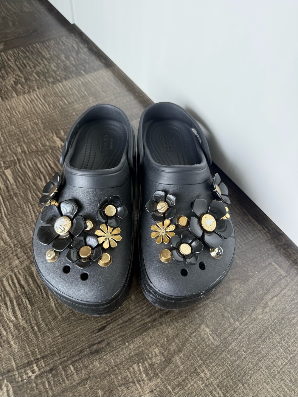 CROCS Black Clog Sandals with Gold Floral Charms